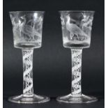 PAIR OF GEORGIAN STYLE WINE GLASSES, 20th century, the bucket shaped bowls engraved with pheasants