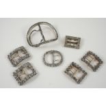 A PAIR OF PASTE SET BUCKLES together with another pair of paste buckles, and three other paste