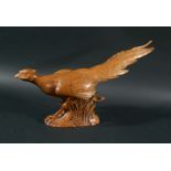 ROBERT THOMPSON OF KILBURN - CARVED PHEASANT a large carved oak figure of a Pheasant in a running