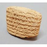 SUMERIAN CLAY PILLOW SHAPED TABLET, inscribed in cuneiform detailing the repayment of debts of