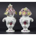 PAIR OF LONGTON HALL VASES AND COVERS, circa 1750-60, of rococo form painted with floral sprigs with