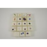 A QUANTITY OF LOOSE COLOURED GEMSTONES of various shapes and sizes, including sapphire, ruby, topaz,
