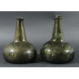 VERY NEAR PAIR OF OLIVE GREEN GLASS ONION SHAPED WINE BOTTLES, 18th century, with high kick bases,