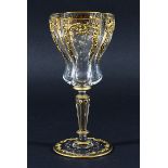 VENETIAN WINE GLASS, of quatrefoil form, enamelled with floral swags beneath tooled gilt scrolls,
