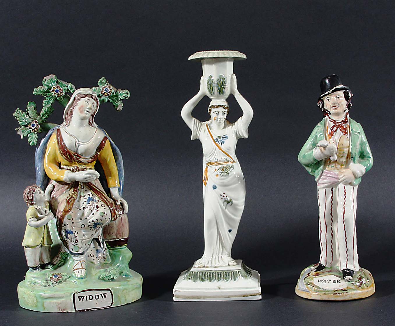 PRATTWARE CANDLESTICK, circa 1800, a classical maiden holding up the sconce, height 25cm; together