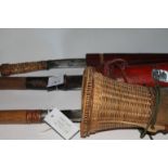 DYAK KNIVES etc A Burmese hatchet bladed knife in red painted wooden scabbard, with 7.1/2" blade.