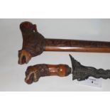 A JAVANESE KRIS. A Javanese Kris with carved wooden hilt and scabbard, of large size. The hilt of