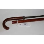 A SWORDSTICK. A cane mounted swordstick with triangular hollow-ground rapier blade, of 21,1/4"