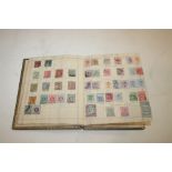 STAMP ALBUM various World stamps including an early stock down album, postal stationery cards