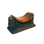 TRIBAL HEAD REST - PAPUA NEW GUINEA a hardwood head rest with a carved face on each end, the