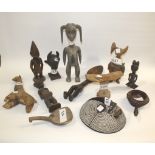 AFRICAN TRIBAL ITEMS a mixed lot including a variety of wooden figures, head rest, mask, pestle,