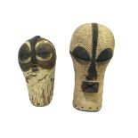 TWO AFRICAN TRIBAL MASKS - SONGE the two wooden masks painted and with pierced holes around the edge