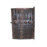 AFRICAN DOGON DOOR - TRIBAL INTEREST a hardwood door carved with a variety of figures and animals,