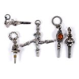 19THC WATCH KEYS 5 decorative watch keys including a multi shank key with man, Pistol, Pixie, and