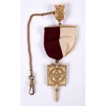MASONIC WATCH KEY a Masonic watch key with lodge ribbon, fob and chain.