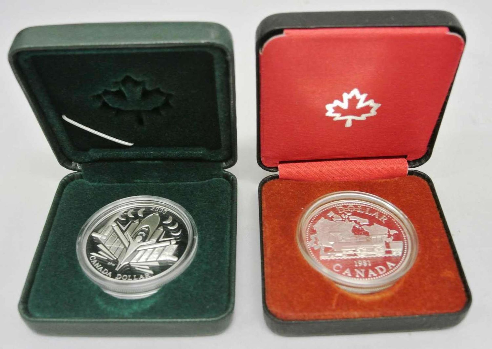 2x Canada Silberdollar, 1x Eisenbahn 1981, sowie 1x Voyage of Discovery 2000 in Original