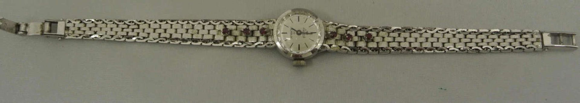 Damenarmbanduhr, 835er Silber, Luxus, Armband besetzt mit 6 kleinen Rubinen. Länge ca. 19 cm. Uhr