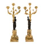 A Pair of French Gilt and Patinated Bronze Figural Three-Light Candelabra Height 20 inches.