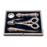 A Victorian Silver Needlework Compendium Length of scissors 4 3/4 inches.