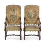 A Pair of Louis XIV Walnut Armchairs Height 50 3/4 inches.