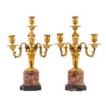 A Pair of Continental Gilt Bronze Three-Light Figural Candelabra Height 15 inches.