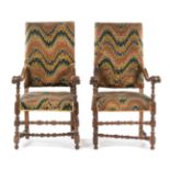 A Pair of Italian Baroque Walnut Armchairs Height 51 inches.
