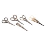 Three Pairs of Silver-Handled Embroidery Scissors Length of longest 3 5/8 inches.