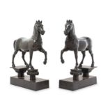 A Pair of Continental Bronze Models of Horses Height 12 3/4 inches.