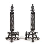 A Pair of Wrought Iron Andirons Height 36 inches.