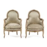 A Pair of Louis XV Style Painted and Gilt Bergeres Height 34 7/8 inches.