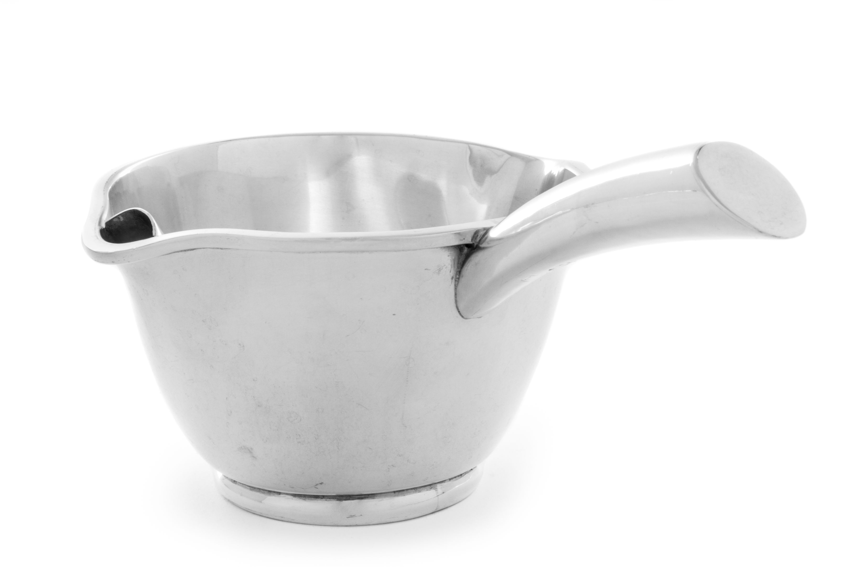 A Mexican Silver Sauce Boat, Juvento Lopez Reyes, Mexico City, the body having twin spouts, one