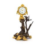 A French Gilt and Patinated Bronze Figural Clock Height 11 1/8 inches.