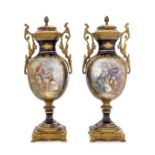 A Pair of Sevres Style Porcelain Urns Height 12 3/4 inches.