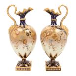 A Pair of Royal Crown Derby Porcelain Ewers Height 15 3/4 inches.