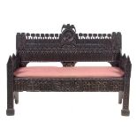 A Gothic Revival Oak Bench Width 59 1/2 inches.