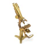 An English Brass Binocular Microscope Height 19 1/4 inches.