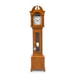 An American Maple Dwarf Tall Clock Height 60 1/4 x width 13 1/2 x 8 inches.