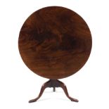 A George III Mahogany Tilt-Top Tea Table Height 28 1/2 x diameter of top 37 7/8 inches.