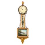 A Federal Style Mahogany and Parcel Gilt Banjo Clock Height 40 1/2 inches.