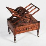 A 19th century rosewood Canterbury, the rectangular top with three divisions, fronted with foliate