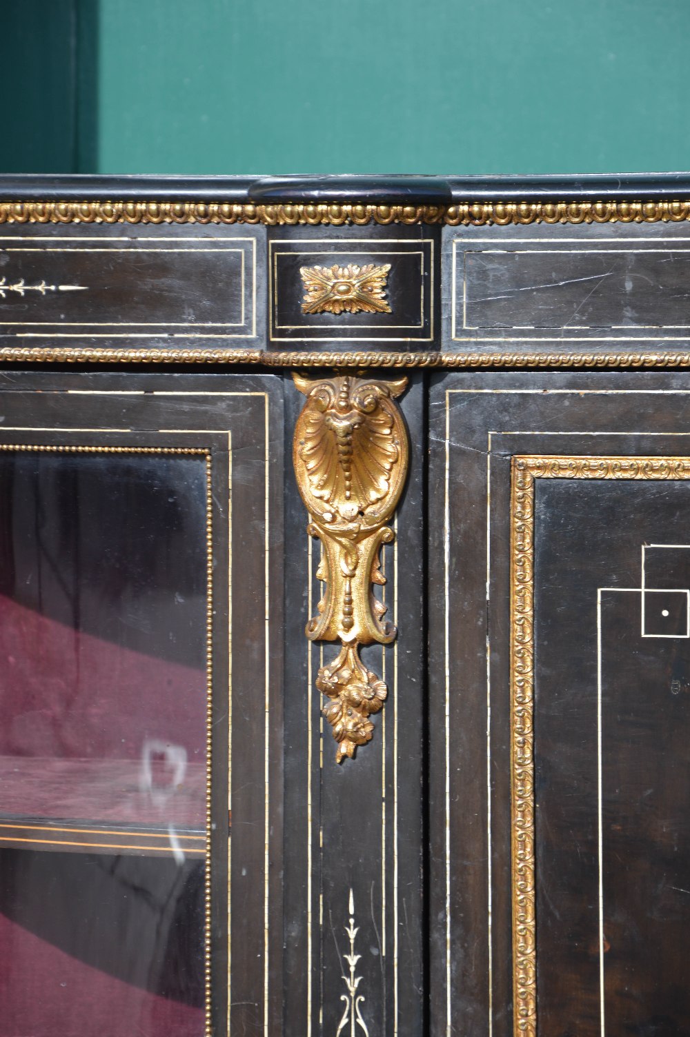 A Victorian ebonised, ivory inlaid and ormolu mounted credenza, the central panelled cupboard door - Image 3 of 3