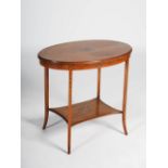 An Edwardian mahogany and satinwood banded polychrome decorated occasional table, the oval top