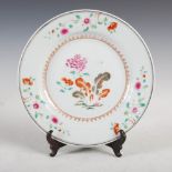 A Chinese famille rose porcelain plate, Qing Dynasty, decorated with peony spray in diaper and peony