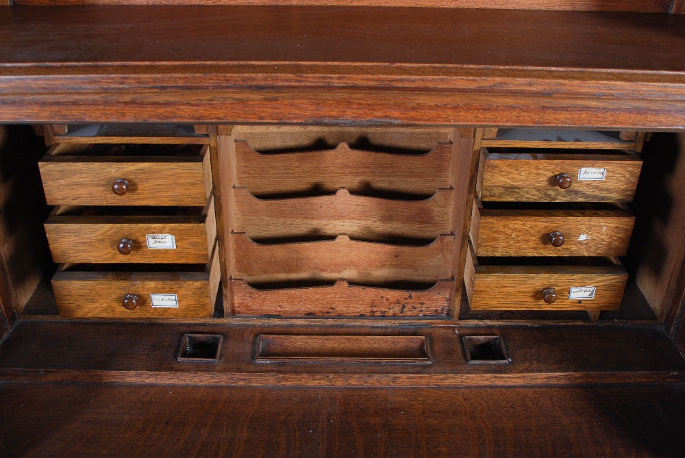 An oak Arts & Crafts style bureau bookcase, the moulded cornice above a plain frieze centred with - Image 3 of 7