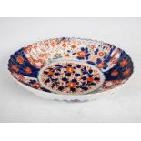 A Japanese Imari oval shaped dish, decorated with flowers and foliage, 25.5cm wide x 5.5cm high.