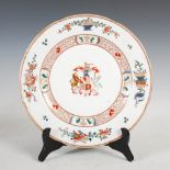 A Samson porcelain famille rose style armorial charger, 32cm diameter.