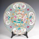 A Chinese porcelain famille rose blue ground charger, late Qing Dynasty, the central circular
