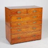 A 19th century teak and brass bound two part secretaire chest, the upper section with two short