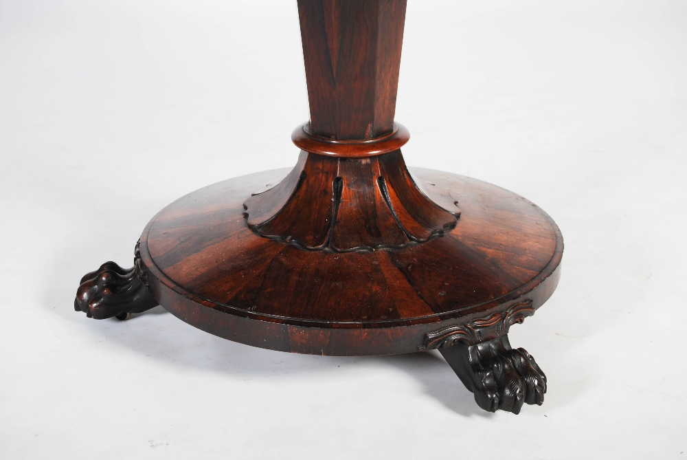 A 19th century rosewood snap top dining table, the hinged circular top raised on a tapered octagonal - Image 5 of 6