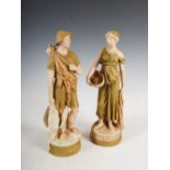 A pair of Royal Dux porcelain figure groups, the male figure modelled holding game bird, the